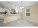 Bright dining area featuring updated fixtures and a breakfast bar at 1302 Windsong Dr, Lakeland, FL 33811