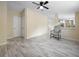 Comfortable living area featuring stylish flooring and chair at 1302 Windsong Dr, Lakeland, FL 33811
