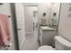 Neutral bathroom featuring a single sink vanity, a framed mirror, and tile flooring at 135 Krenson Bay Loop, Winter Haven, FL 33881