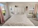 Bright bedroom featuring a large bed, neutral color palette, and natural light at 135 Krenson Bay Loop, Winter Haven, FL 33881