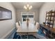 Inviting dining area featuring a modern table set and stylish decor at 135 Krenson Bay Loop, Winter Haven, FL 33881