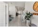 Bright hallway with tile flooring, leading to the living spaces and bedrooms at 135 Krenson Bay Loop, Winter Haven, FL 33881