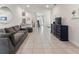 Expansive open floor plan showcasing the living area, kitchen, and entryway at 135 Krenson Bay Loop, Winter Haven, FL 33881