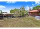 Expansive backyard with waterfront views and a convenient boat dock, perfect for outdoor activities at 142 Lakeview Dr, Haines City, FL 33844