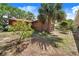 Attractive brick home with mature landscaping, including palm and oak trees, and a red roof at 142 Lakeview Dr, Haines City, FL 33844