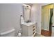 Bathroom featuring a marble vanity, framed mirror, and a tiled floor at 151 Lake Ring Dr, Winter Haven, FL 33884