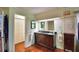 Bathroom with a double sink vanity, ample storage and tile flooring at 151 Lake Ring Dr, Winter Haven, FL 33884