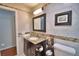 Bathroom with marble tile walls and granite countertops at 151 Lake Ring Dr, Winter Haven, FL 33884