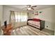 Bright bedroom with natural light, laminated wood floors, and daybed at 151 Lake Ring Dr, Winter Haven, FL 33884