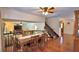 Bright dining area featuring a wooden table with seating, open to the living space, and hardwood floors at 151 Lake Ring Dr, Winter Haven, FL 33884