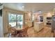 Open-concept kitchen and breakfast area with stainless steel appliances and a center island with marble countertops at 151 Lake Ring Dr, Winter Haven, FL 33884