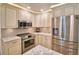 Modern kitchen showcasing stainless steel appliances, sleek countertops, and ample cabinet space at 151 Lake Ring Dr, Winter Haven, FL 33884