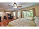 Main bedroom boasting windows to a deck and hardwood floors at 151 Lake Ring Dr, Winter Haven, FL 33884