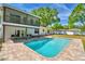 Gorgeous home with refreshing in-ground pool, open patio and an upper screened porch at 151 Lake Ring Dr, Winter Haven, FL 33884