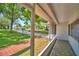 Screened-in porch provides a lovely view of the front yard and neighborhood at 151 Lake Ring Dr, Winter Haven, FL 33884