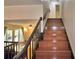 Staircase view with wood steps and railings leading to an upper level at 151 Lake Ring Dr, Winter Haven, FL 33884