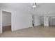 Open concept living area with tile flooring and access to other rooms in the home at 1550 11Th Ne St # G6, Winter Haven, FL 33881