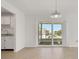 Open living area with large sliding glass doors and tile flooring at 1550 11Th Ne St # G6, Winter Haven, FL 33881