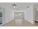 Spacious living room featuring neutral paint, tile floors, and natural light at 1550 11Th Ne St # G6, Winter Haven, FL 33881