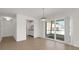 Open living area with large sliding glass doors and tile flooring at 1550 11Th Ne St # G6, Winter Haven, FL 33881