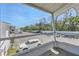 Screened in patio view of the parking lot, building and mature trees at 1550 11Th Ne St # G6, Winter Haven, FL 33881