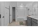 Clean bathroom featuring a shower-tub combination and gray vanity at 1744 Cross Prairie Pkwy, Kissimmee, FL 34744