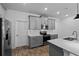 Well-lit kitchen with gray cabinets, stainless steel appliances, and subway tile backsplash at 1744 Cross Prairie Pkwy, Kissimmee, FL 34744