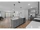 Open-concept layout seamlessly connects the modern kitchen to the living and dining areas at 1744 Cross Prairie Pkwy, Kissimmee, FL 34744