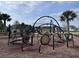 Modern playground featuring climbing structures, slides, and interactive elements on a mulch surface at 1744 Cross Prairie Pkwy, Kissimmee, FL 34744