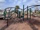 A community playground with swings, slides, and climbing features over a safe, cushioned surface at 1744 Cross Prairie Pkwy, Kissimmee, FL 34744