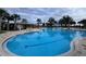A large community pool with lap lanes and lounge chairs for residents' relaxation and enjoyment at 1744 Cross Prairie Pkwy, Kissimmee, FL 34744