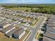 New home in a suburban neighborhood with well-maintained lawns and access to green spaces at 1998 Sarah St, Winter Haven, FL 33884