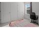 A bedroom featuring a study desk by the window and a comfortable bed at 1998 Sarah St, Winter Haven, FL 33884