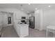 Kitchen featuring stainless steel appliances and an open floor plan that connects to the dining area at 1998 Sarah St, Winter Haven, FL 33884