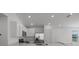 A kitchen featuring stainless steel appliances, white cabinets and a kitchen island at 1998 Sarah St, Winter Haven, FL 33884