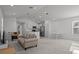 Bright living room featuring neutral decor, an open floor plan, and modern stainless steel appliances at 1998 Sarah St, Winter Haven, FL 33884