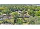 Aerial view of the area, displaying a serene neighborhood with tree-lined streets at 210 Pinehurst Dr, Auburndale, FL 33823