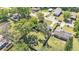 Overhead shot capturing the home's setting amidst lush greenery and neighborhood surroundings at 210 Pinehurst Dr, Auburndale, FL 33823