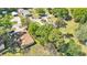 Aerial view of the neighborhood showing the home's location among mature trees and residential streets at 210 Pinehurst Dr, Auburndale, FL 33823