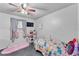 Light and airy bedroom with fun decor, colorful bedding, and bright natural light at 210 Pinehurst Dr, Auburndale, FL 33823