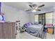 Bright bedroom featuring vibrant LED lights, patterned bedding, and comfortable furnishings at 210 Pinehurst Dr, Auburndale, FL 33823