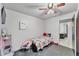 A cheerful bedroom features a brightly colored bed and cute decorations for a cozy feel at 210 Pinehurst Dr, Auburndale, FL 33823