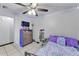 Comfortable bedroom with LED accent lighting, a dresser, and a cozy bed for relaxing at 210 Pinehurst Dr, Auburndale, FL 33823