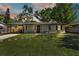 Beautiful single-story home featuring a pristine front lawn and covered carport at 210 Pinehurst Dr, Auburndale, FL 33823