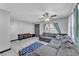 Inviting living room features a large sectional sofa, tile floors, and ample lighting at 210 Pinehurst Dr, Auburndale, FL 33823