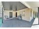 Covered patio features starry night ceiling, seating, and direct access to the home at 210 Pinehurst Dr, Auburndale, FL 33823