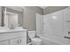 Bathroom featuring white vanity, toilet, and bathtub, providing a clean and modern feel at 225 Babson Dr, Babson Park, FL 33827