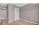 Bedroom featuring a closet, light gray walls, and neutral flooring creating a modern aesthetic at 225 Babson Dr, Babson Park, FL 33827
