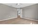 Bedroom with view to kitchen, closet and neutral flooring offers a calm aesthetic appeal at 225 Babson Dr, Babson Park, FL 33827