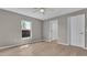 Bedroom features a view of a screened in patio and ensuite bath, offering a private retreat at 225 Babson Dr, Babson Park, FL 33827